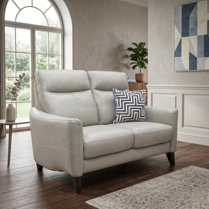 Living room of the Petit sofa, showcasing the contoured high back designed for optimal lumbar and neck support.