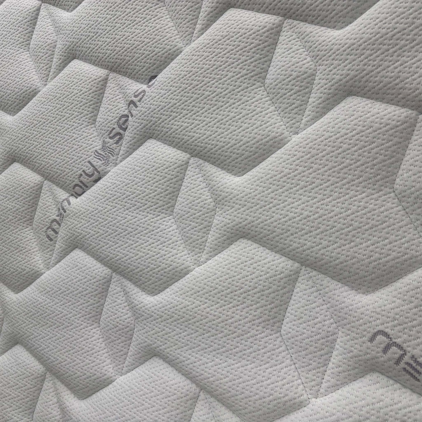 Close-up of the Sleepeezee branding and the "Memory Sense" label, signifying the Royal Warranted craftsmanship and premium quality materials.