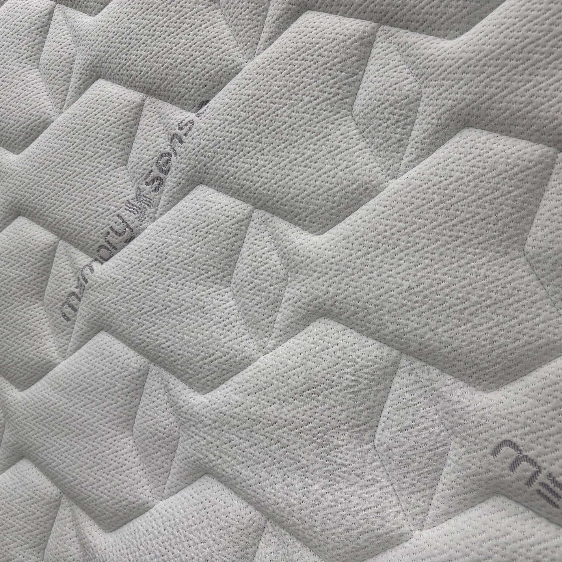 Close-up of the Sleepeezee branding and the "Memory Sense" label, signifying the Royal Warranted craftsmanship and premium quality materials.