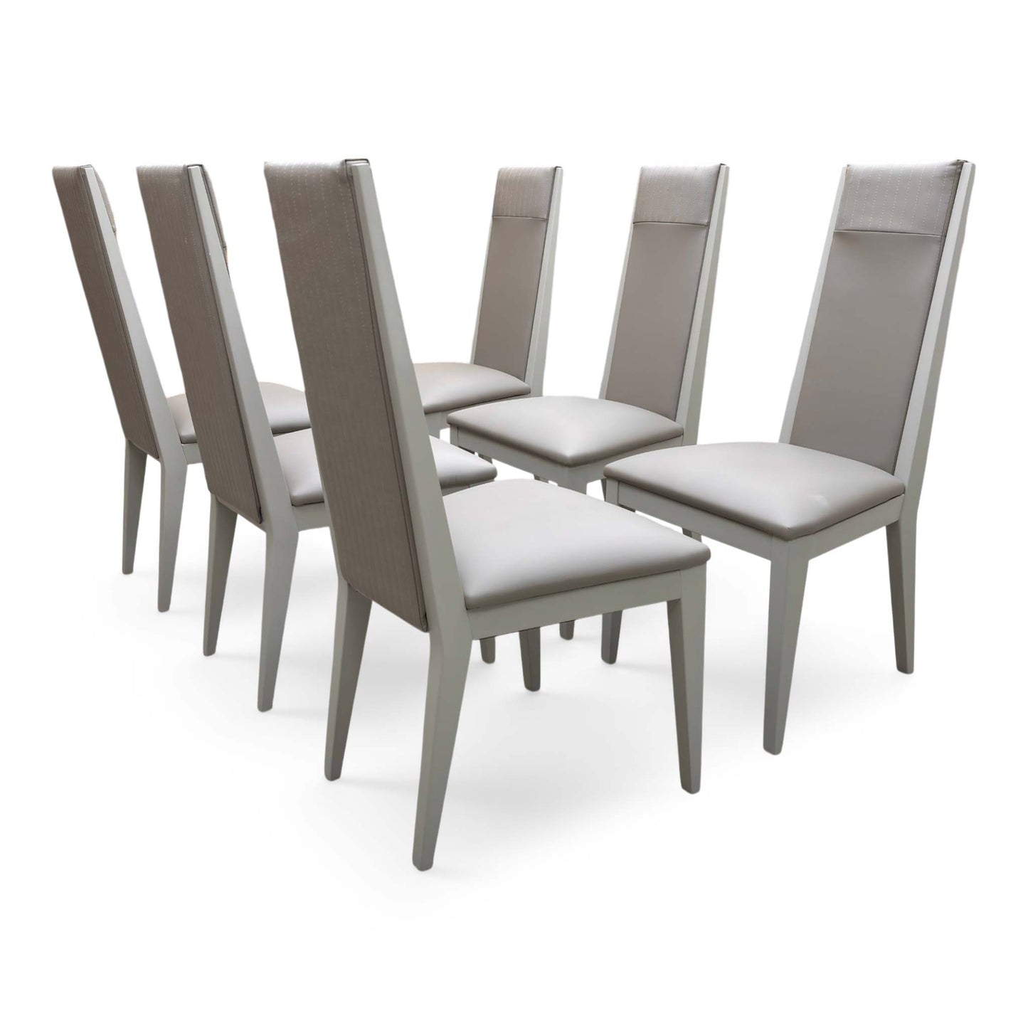 Full view of the set of 6 ‘Lusso’ dining chairs in Taupe faux leather, featuring a contemporary high-back design with vertical panelled stitching and sleek black metal legs.