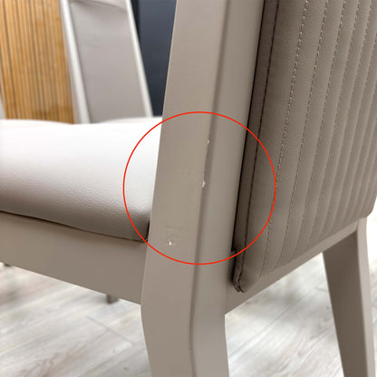 Detail shot of the black powder-coated metal legs, showing the tapered design and the protective feet glides to prevent floor scratching.