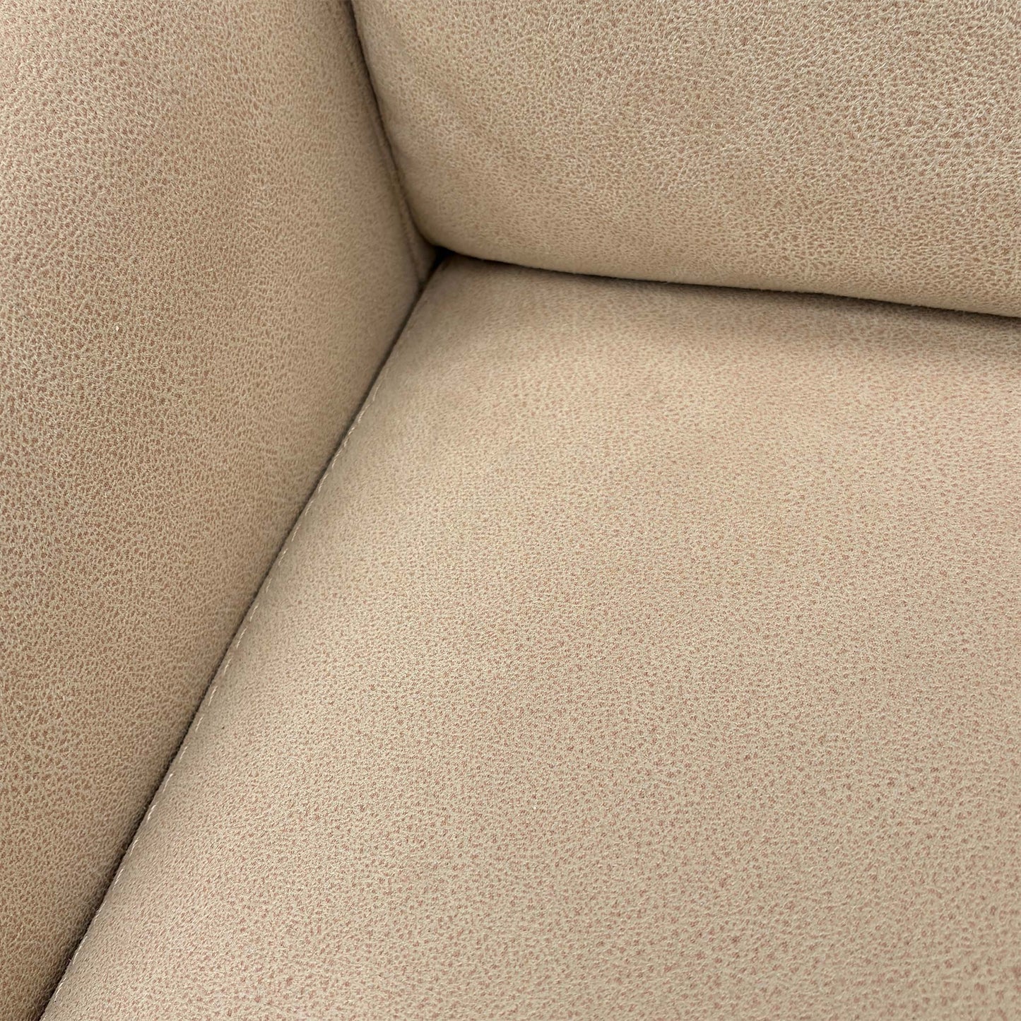 Detailed close-up of the Bisque Cream Suede fabric, emphasizing the soft texture and high-quality finish of the upholstery.