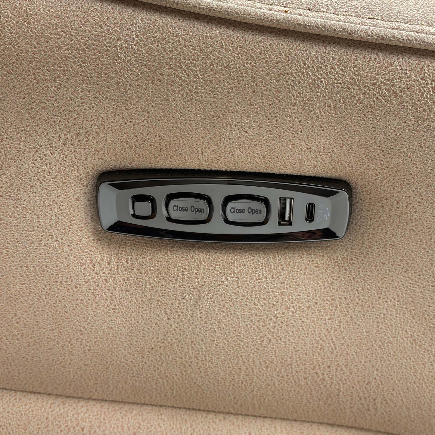 Close-up of the side control panel, showing the power reclining buttons and the handy USB device charging port.