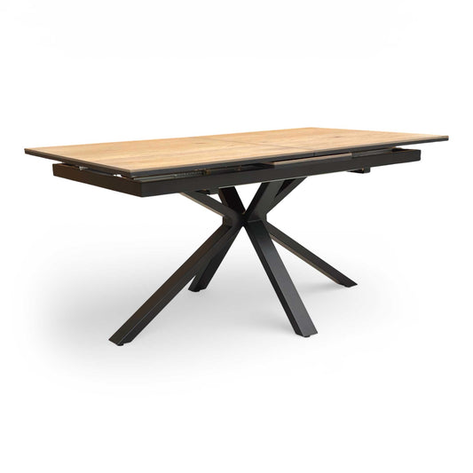 Full view of the Furniture Village ‘Saturn’ oak dining table in its compact 160cm form, featuring a solid oak top and black metal legs.