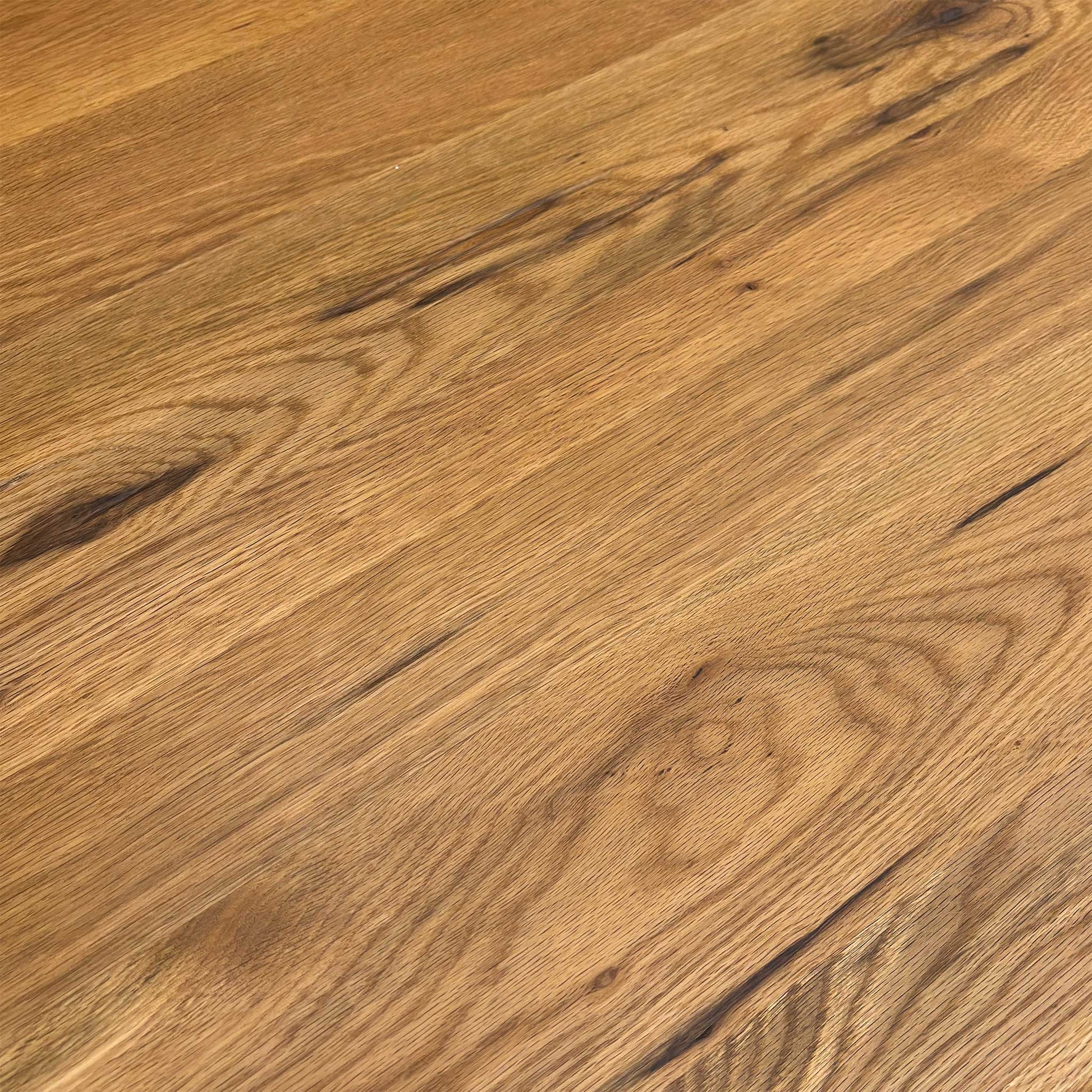 Detail close-up of the raw edge table top, highlighting the natural imperfections and high-quality oiled finish.