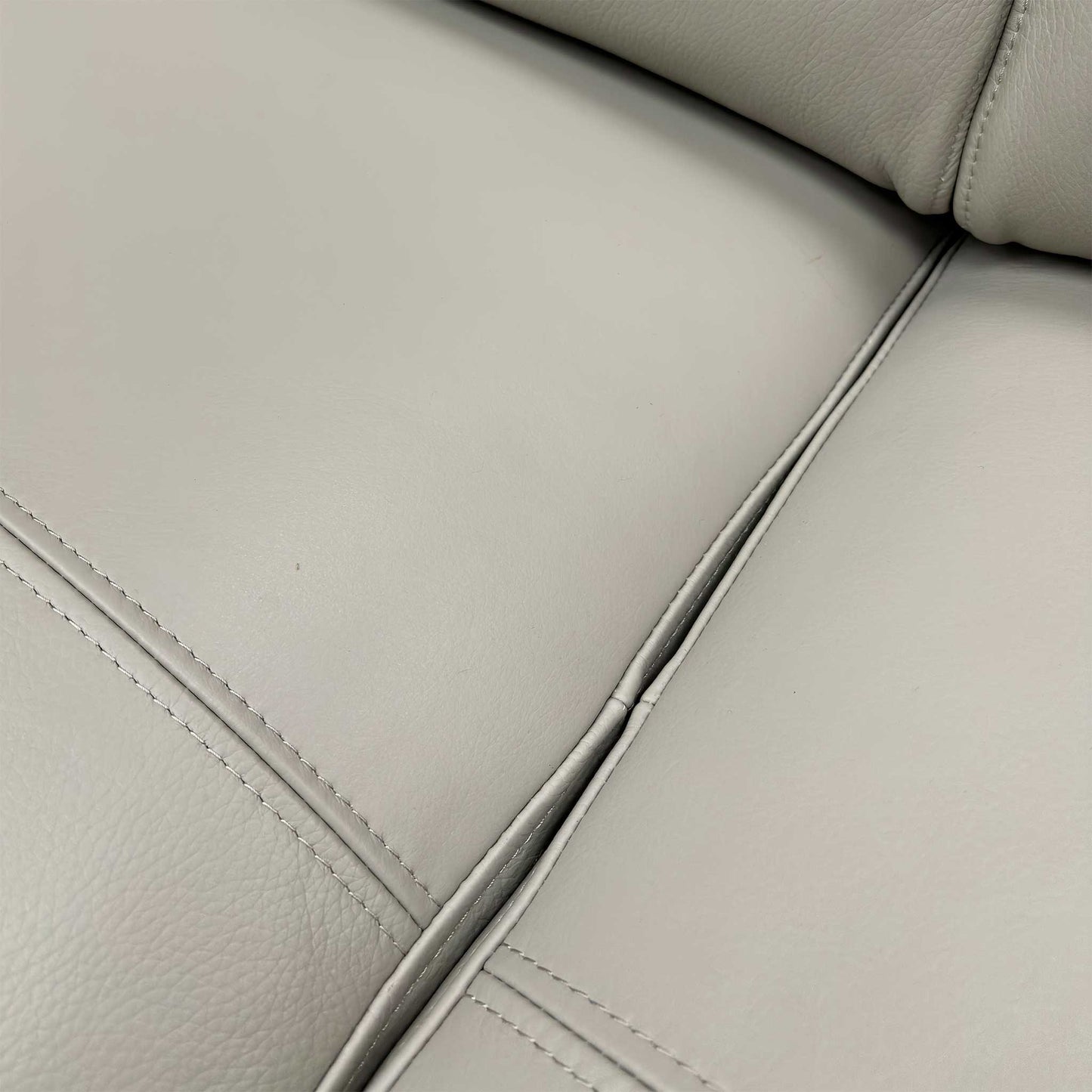Close-up of the sofa's stitching details, highlighting the high-quality construction and tailored finish.