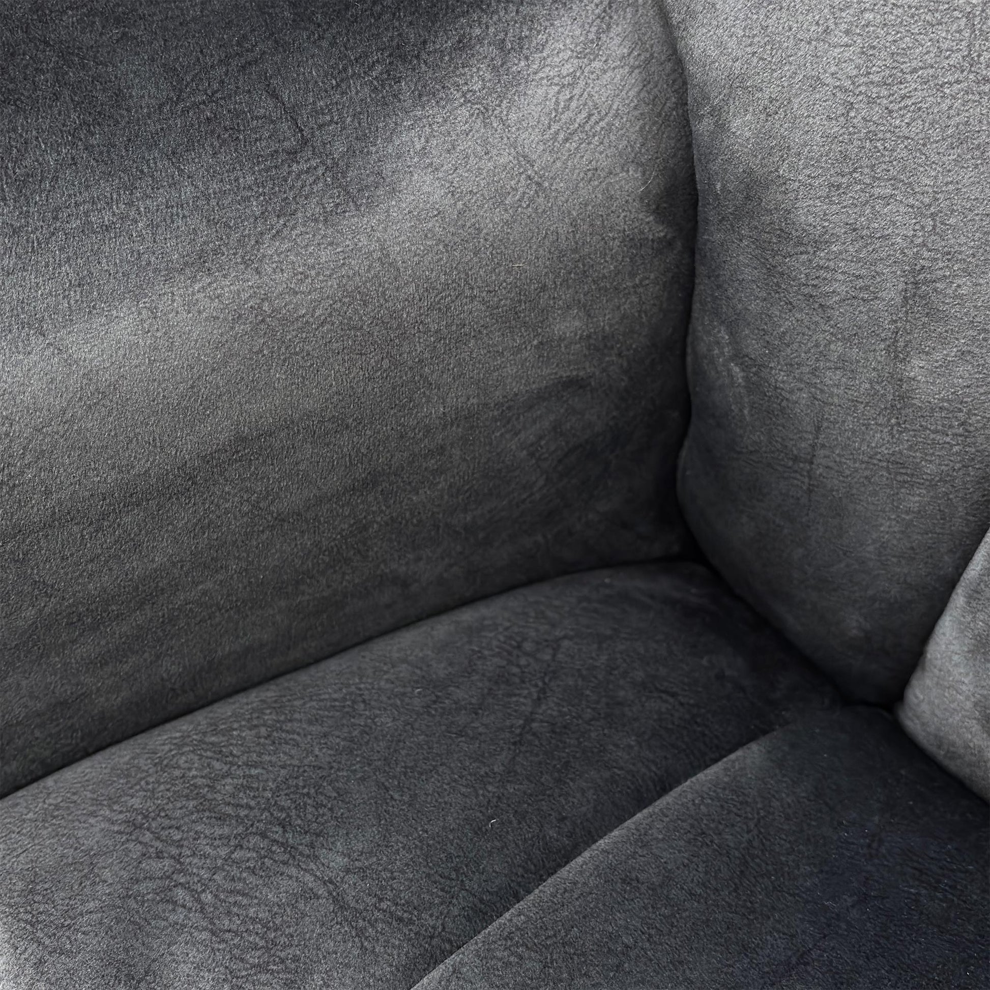 Detailed close-up of the luxurious liquorice charcoal velvet upholstery, showcasing the soft texture and premium fabric quality.