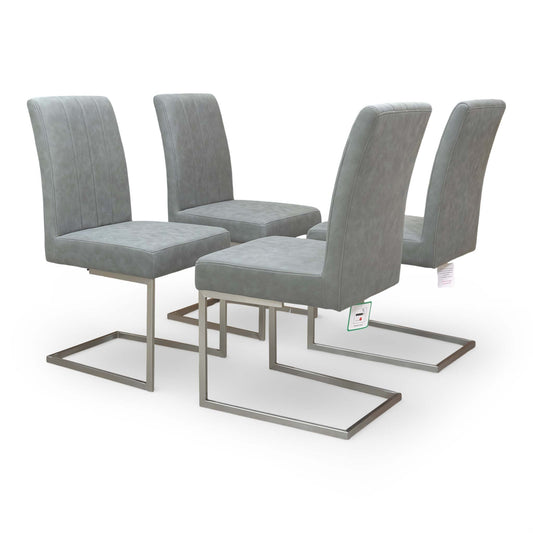Front view of the Furniture Village ‘Grigio’ Cantilever Dining Chairs in Grey faux leather, presented as a set of four.