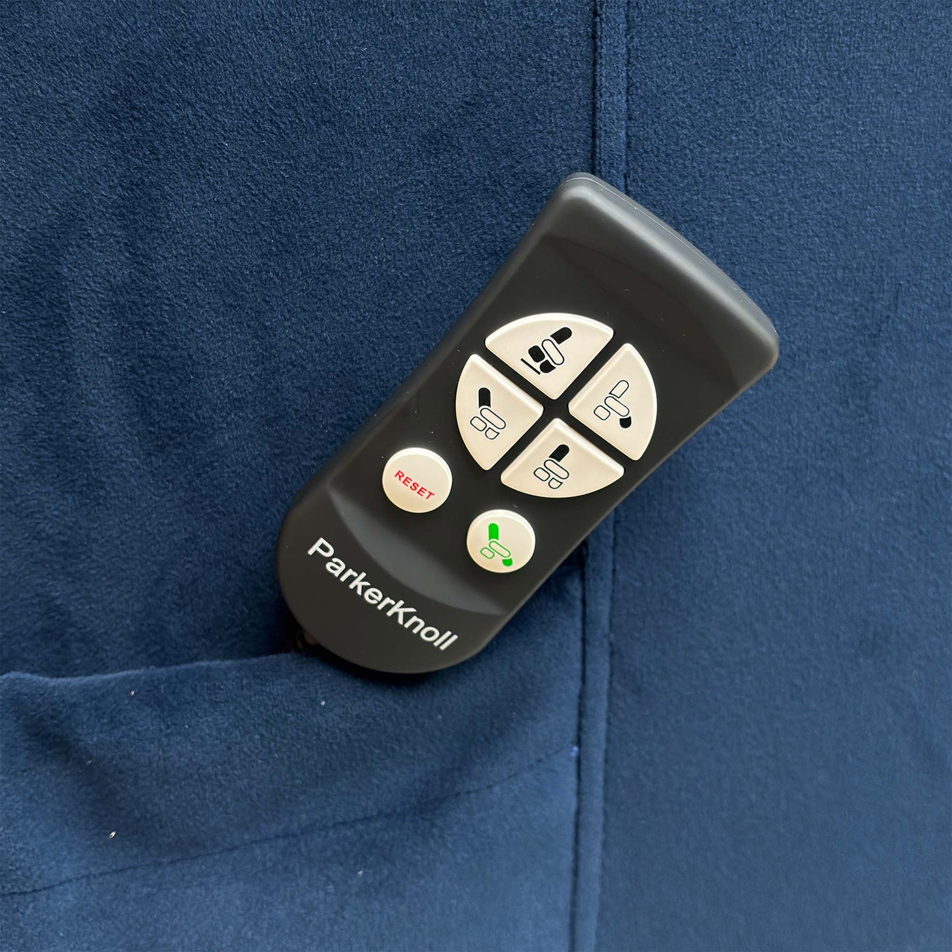 Detailed view of the chair's padded arm cushions and side control panel.