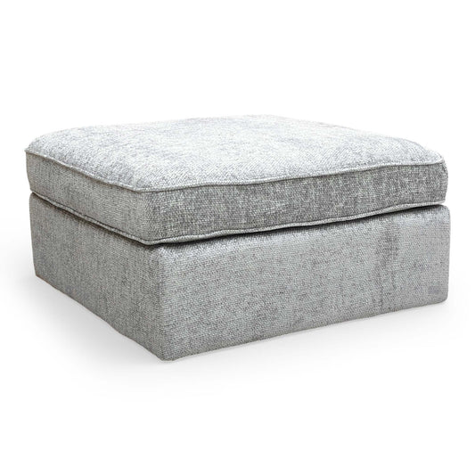full view of the Emilia square footstool in Stone woven fabric, showcasing its modern, clean-lined design.