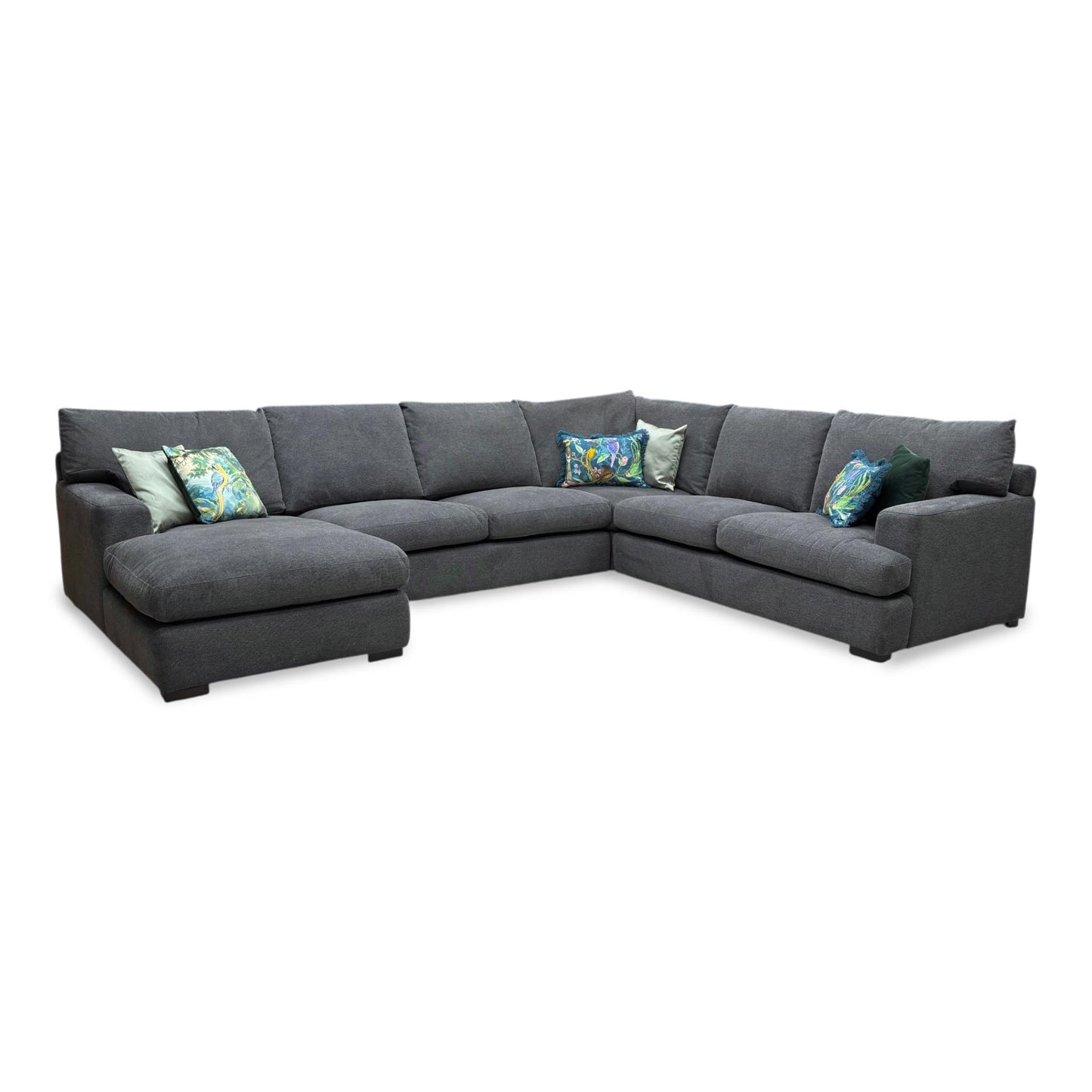 Full view of the charcoal fabric sofa, highlighting the wide seating area, plush cushions, and contemporary silhouette.
