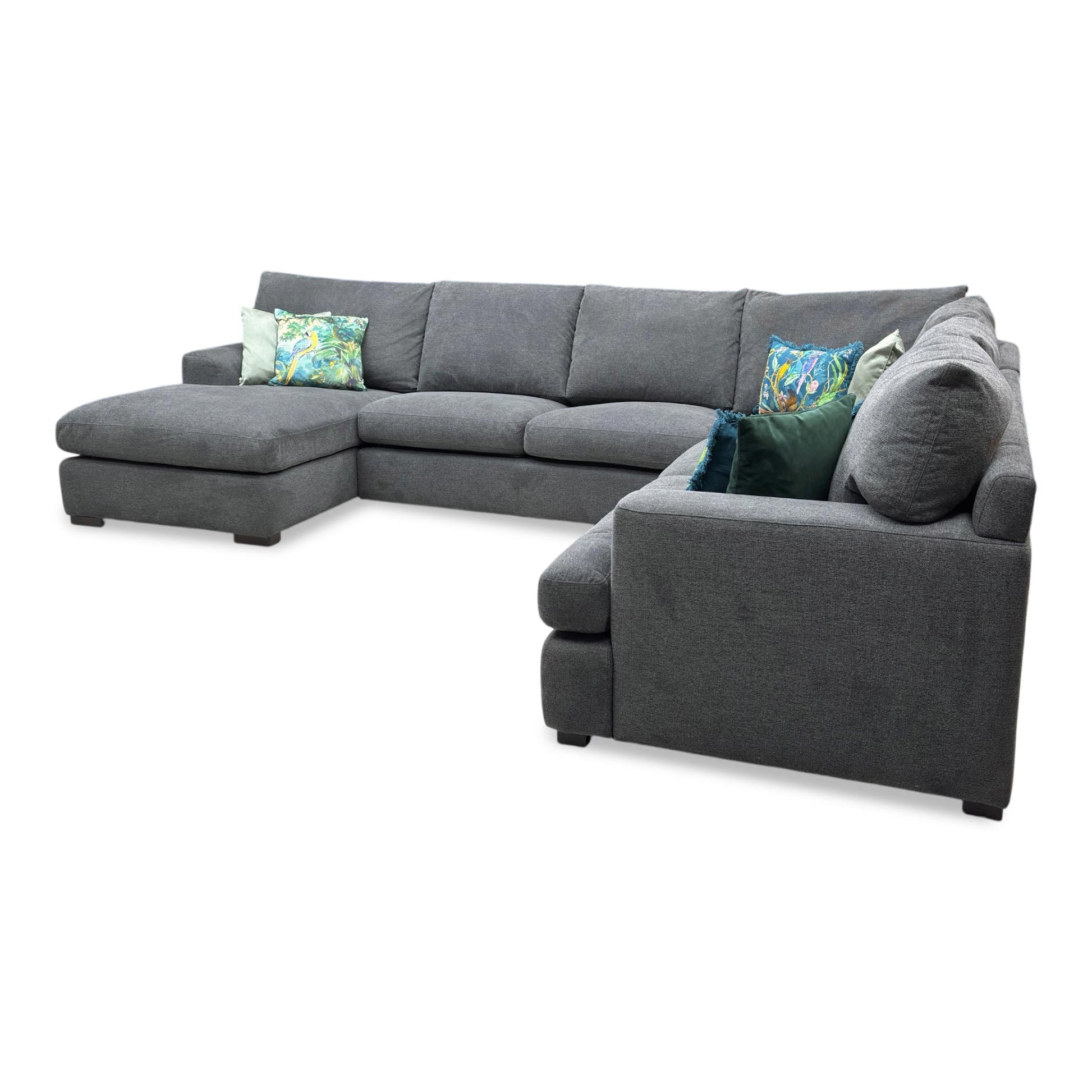 Perspective shot showing the long chaise end of the Daniel corner sofa, perfect for stretching out in spacious living rooms.