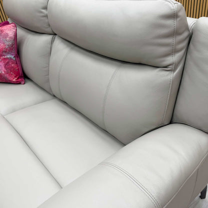 Detailed close-up of the premium oyster leather upholstery and stitching details on the recliner sofa.