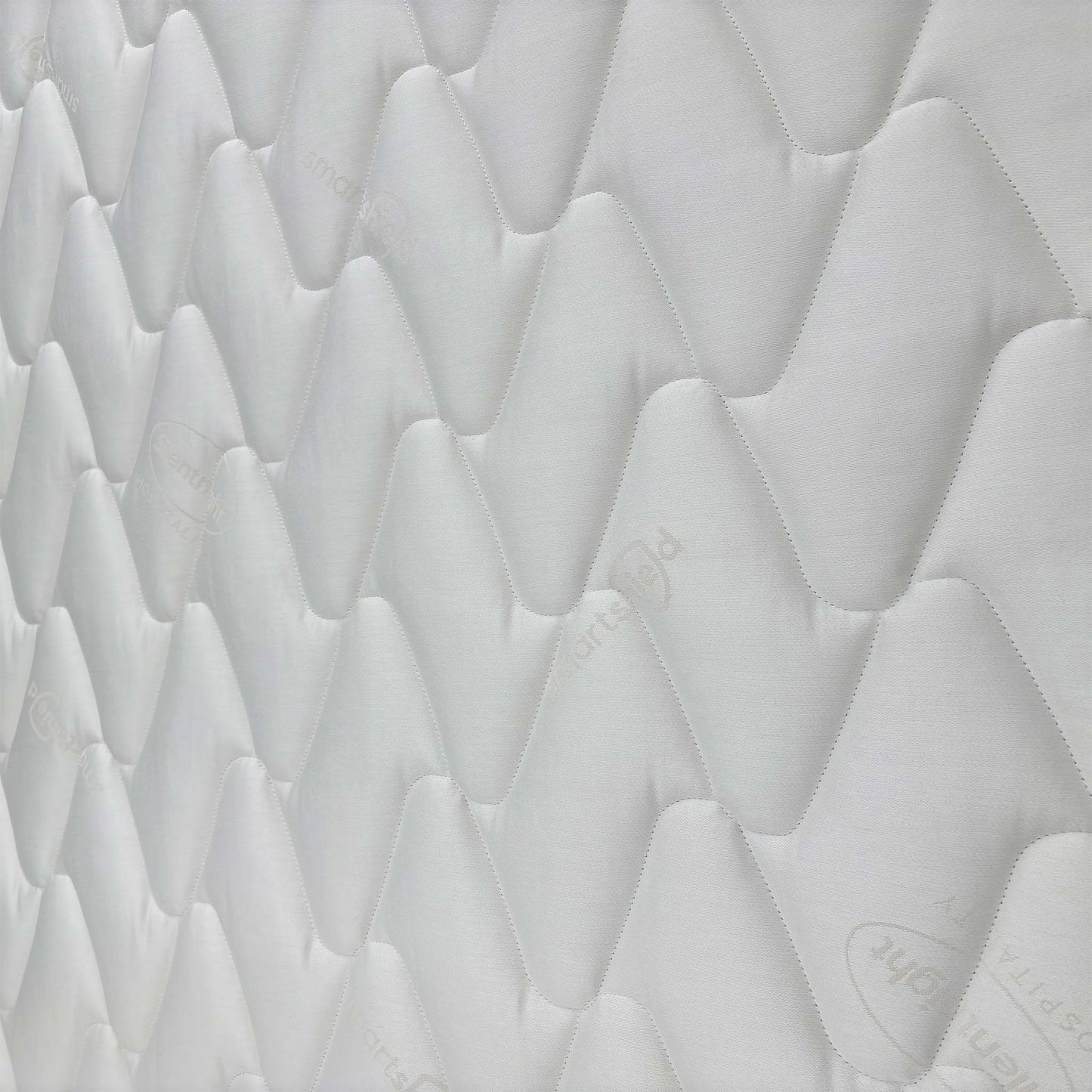 Detailed close-up of the mattress surface, showing the high-quality stitching and breathable cover designed for commercial use.