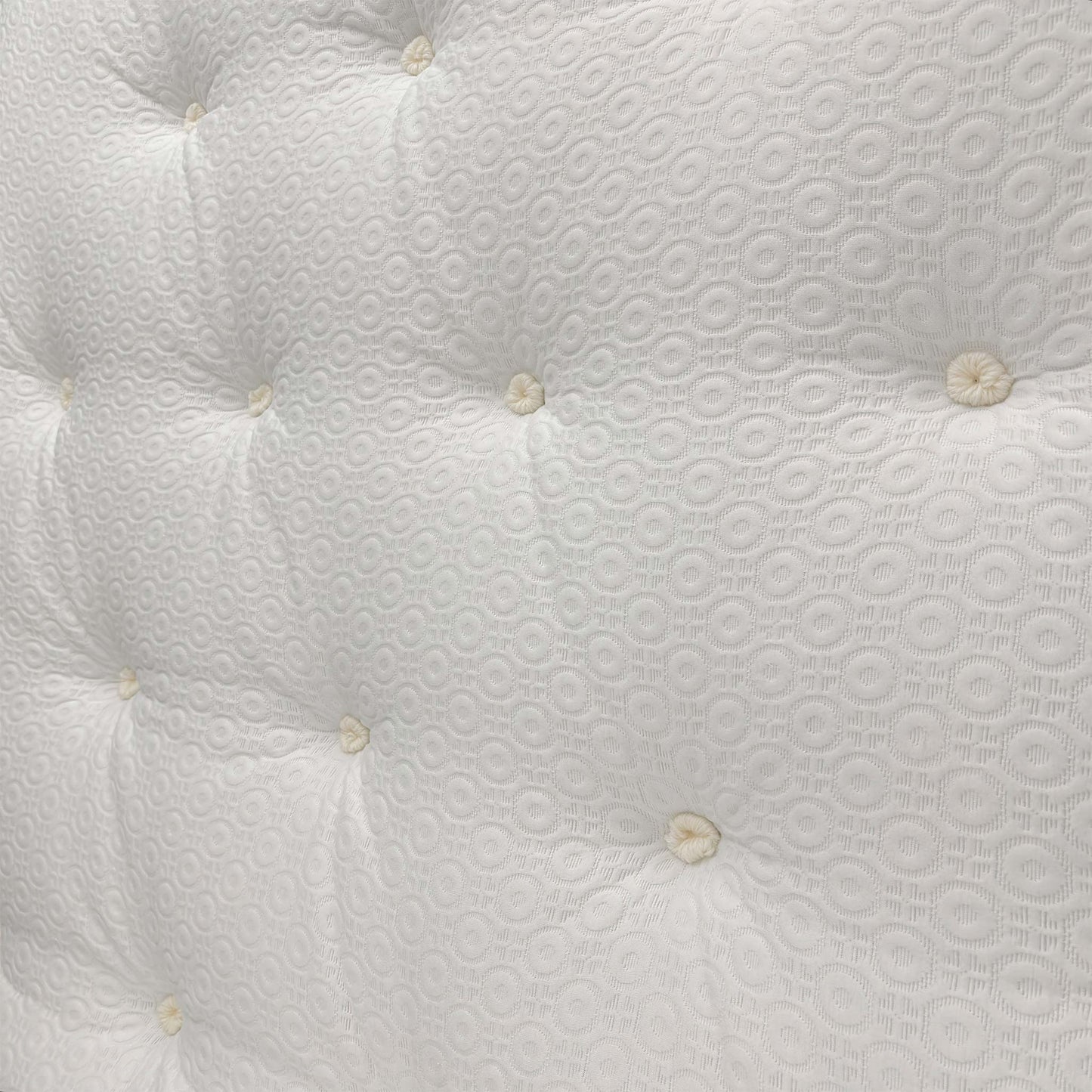 Detailed close-up of the mattress surface, featuring the breathable fabric cover and signature memory foam comfort layer.