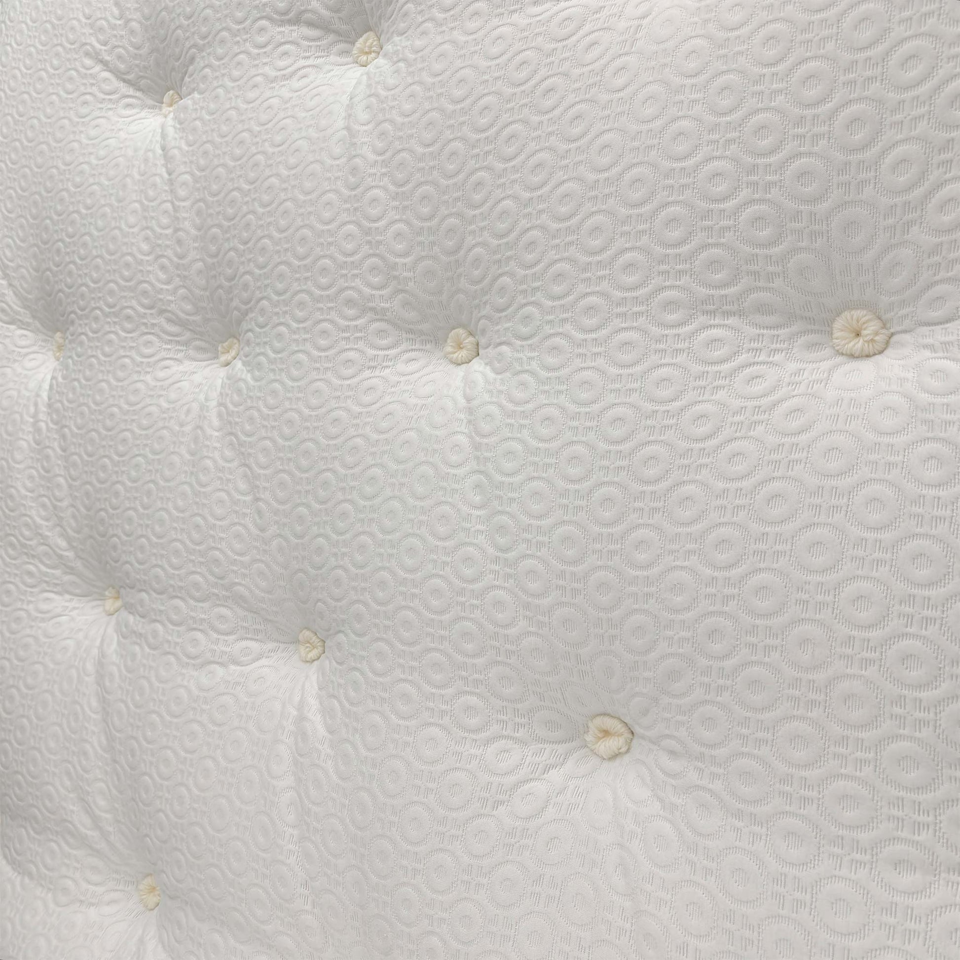 Detailed close-up of the mattress surface, featuring the breathable fabric cover and signature memory foam comfort layer.
