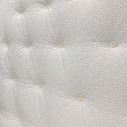 Detailed close-up of the mattress surface, featuring the breathable fabric cover and signature memory foam comfort layer.