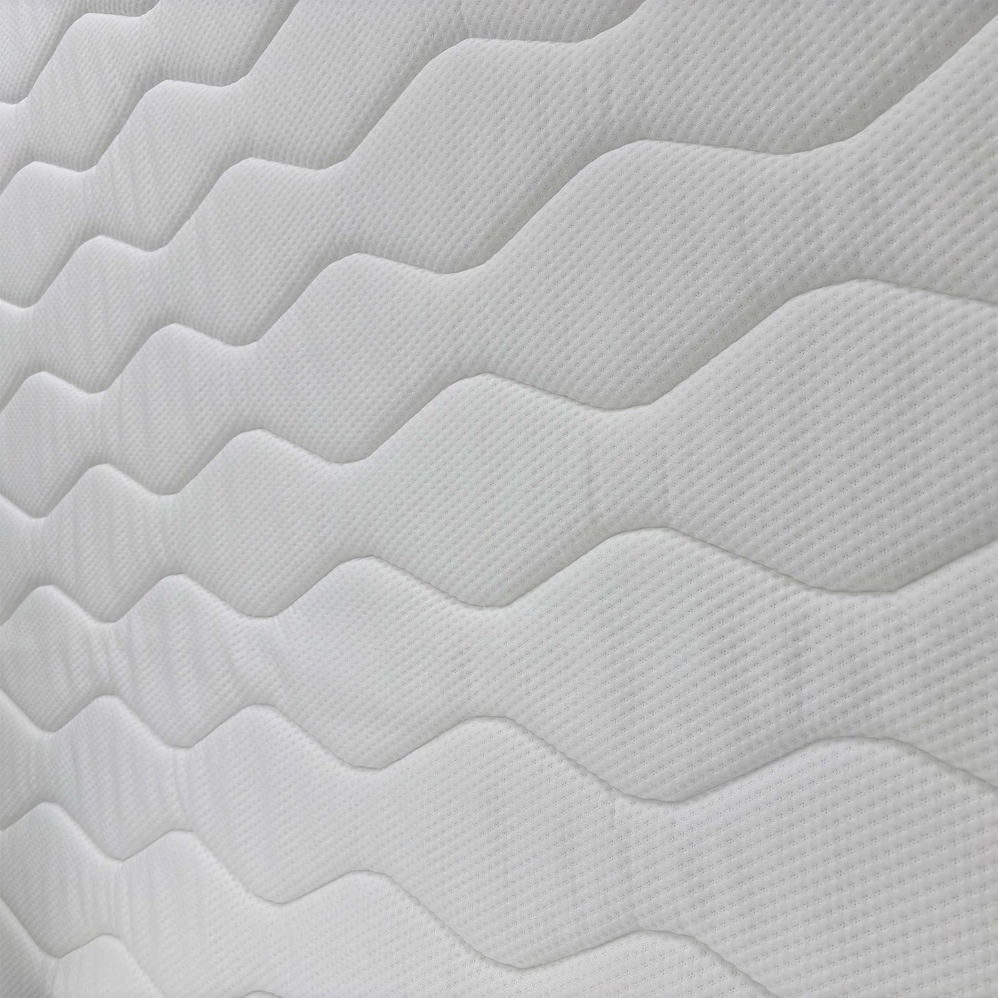 Detailed close-up of the mattress surface fabric, emphasizing the quilted finish and pressure-relieving gel technology.