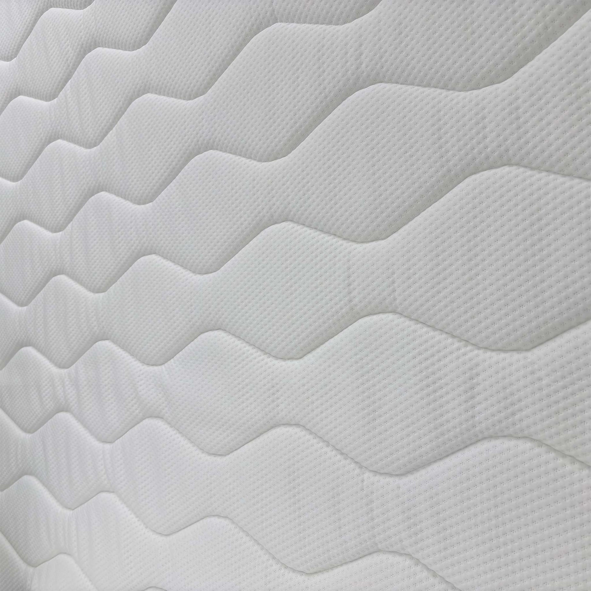 Detailed close-up of the mattress surface fabric, emphasizing the quilted finish and pressure-relieving gel technology.