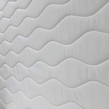 Detailed close-up of the mattress surface fabric, emphasizing the quilted finish and pressure-relieving gel technology.