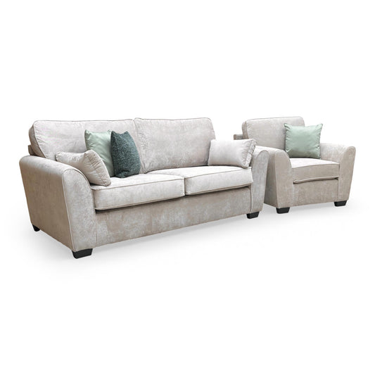 Front view of the Thornbrook ‘Julius’ 3-seater sofa and matching armchair, upholstered in soft mink-toned Kingston fabric with a contemporary silhouette.