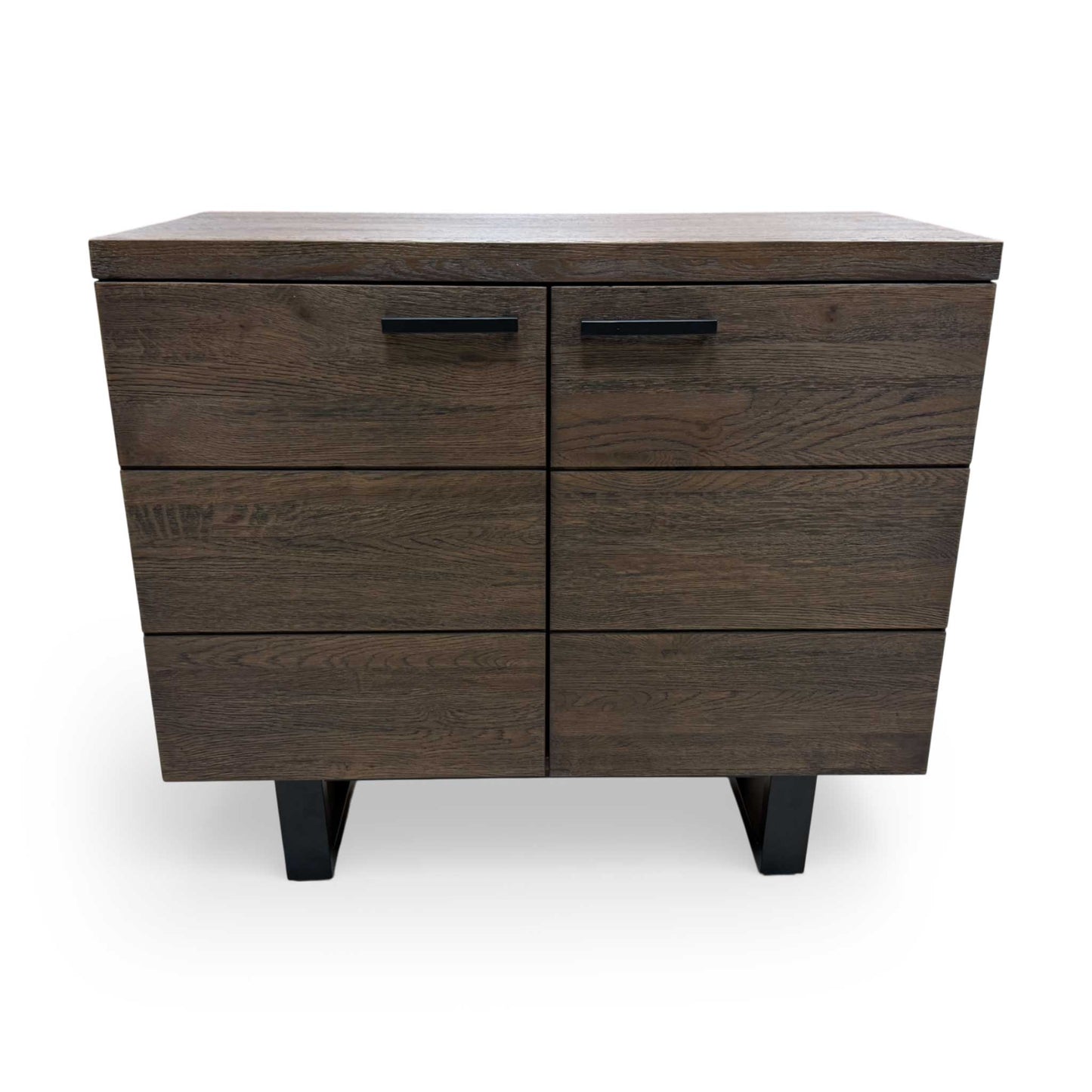 Interior compartment of the small sideboard with doors open, showing the spacious storage area for linens, tableware, or books.