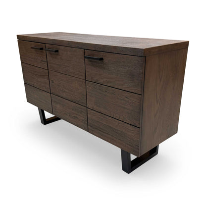 View of the sideboard's base and tapered legs, emphasizing the sturdy construction and contemporary-classic aesthetic.
