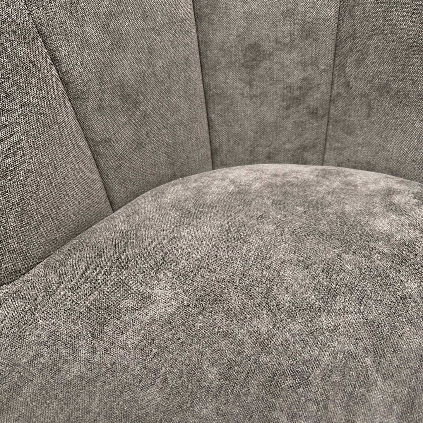 Close-up of the Talon chair's floral upholstery, showing the intricate botanical pattern in warm earth tones against the textured brown fabric.