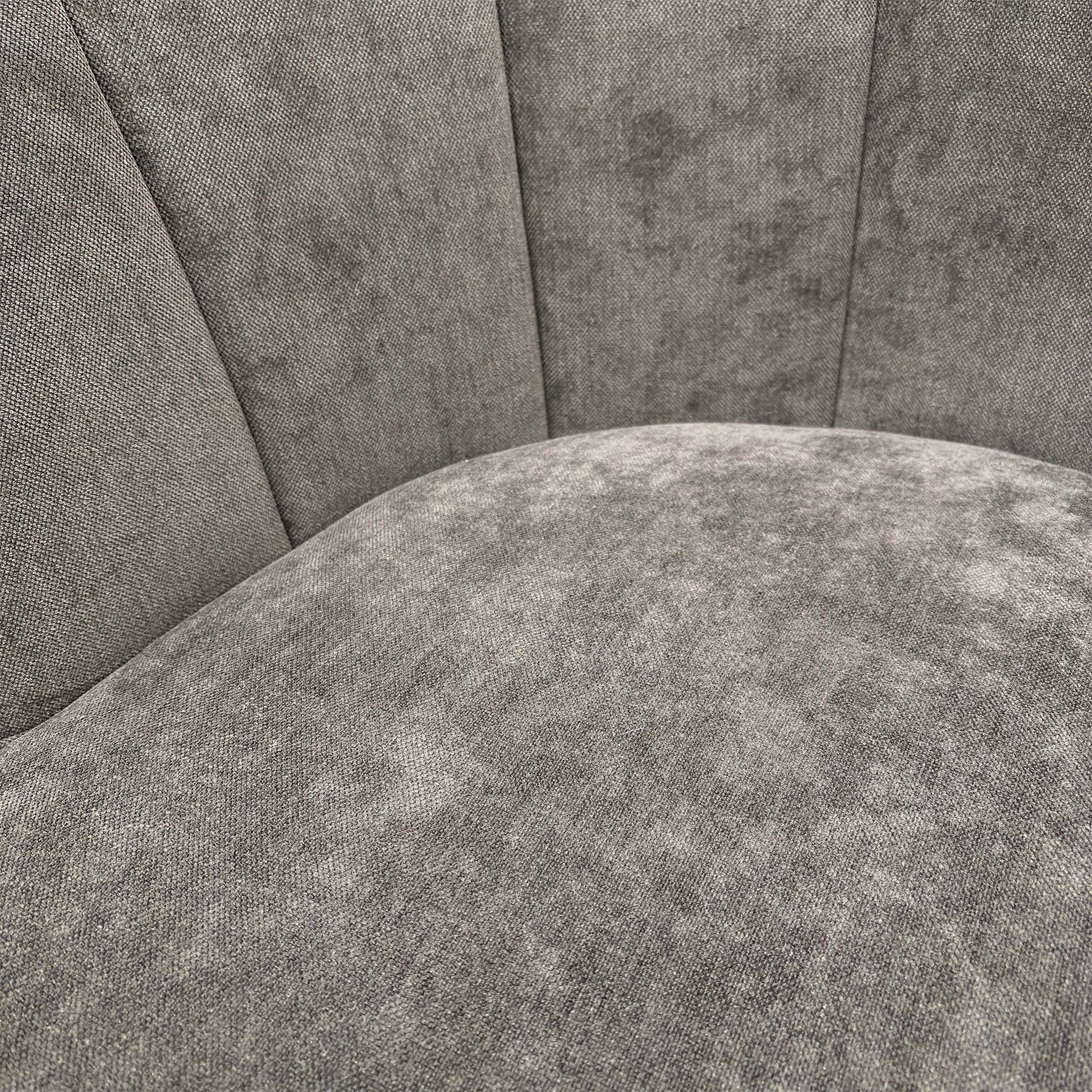 Close-up of the Talon chair's floral upholstery, showing the intricate botanical pattern in warm earth tones against the textured brown fabric.
