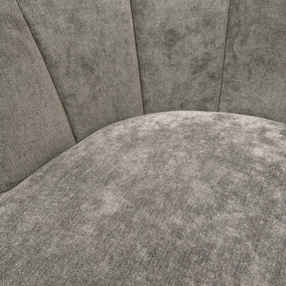 Close-up of the Talon chair's floral upholstery, showing the intricate botanical pattern in warm earth tones against the textured brown fabric.