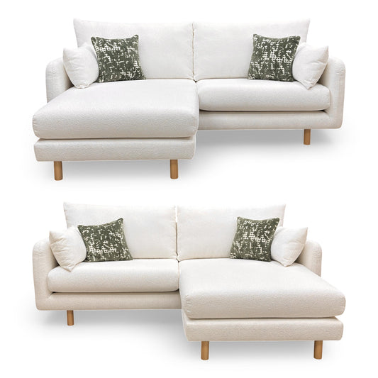 Full view of the 'Aero' 4-seater sofa in ivory boucle fabric, featuring a clean-lined modern silhouette.