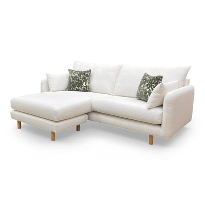 Three-quarter view of the Aero sofa, highlighting the textured boucle fabric and deep-seated comfort.