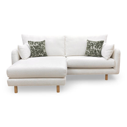 Front view of the 'Aero' 4-seater sofa in ivory boucle fabric, featuring a clean-lined modern silhouette.