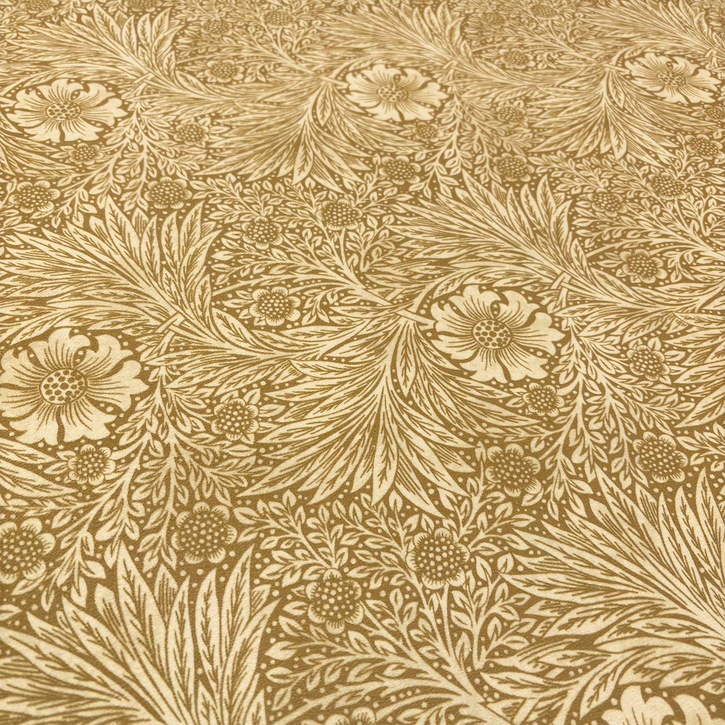 Close-up of the yellow velvet fabric, detailing the intricate floral pattern with soft leaves and botanical motifs.