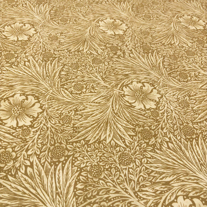 Close-up of the yellow velvet fabric, detailing the intricate floral pattern with soft leaves and botanical motifs.