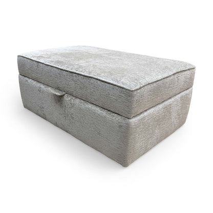 Side profile of the Sasha storage footstool, showcasing the uniform cushioning and sleek contemporary lines.