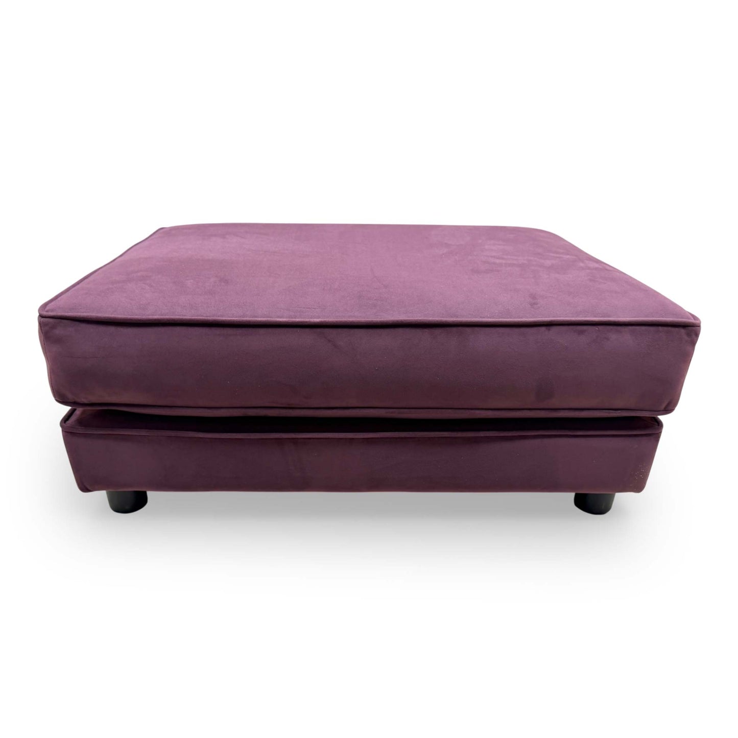 Front-facing shot of the The Lounge Co. footstool, highlighting its elegant rectangular silhouette and tactile frosted velvet finish.