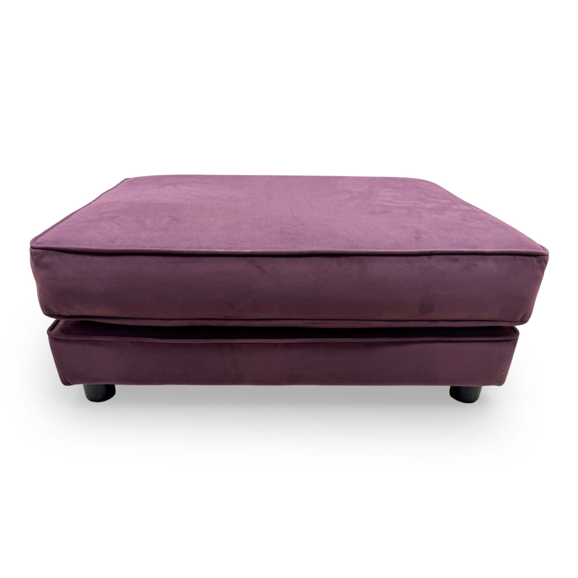 Front-facing shot of the The Lounge Co. footstool, highlighting its elegant rectangular silhouette and tactile frosted velvet finish.