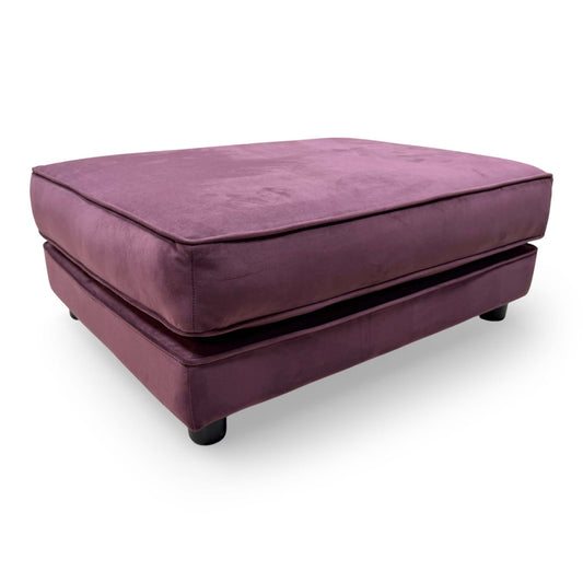 Front-facing shot of the The Lounge Co. footstool, highlighting its elegant rectangular silhouette and tactile frosted velvet finish.