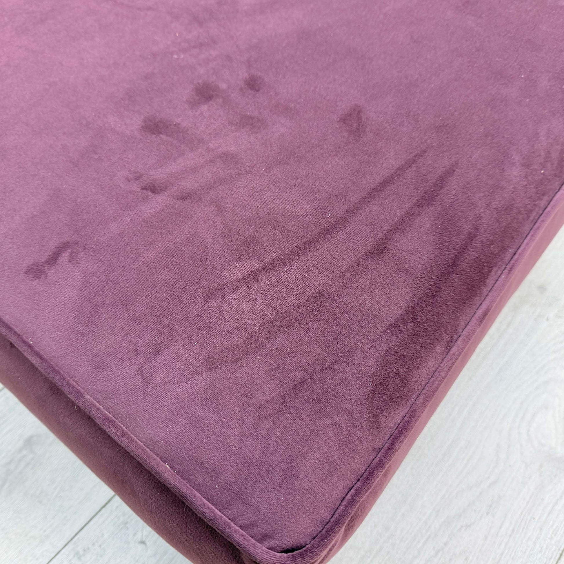 Close-up of the Frosted Grape purple velvet fabric, showing the intricate texture and vibrant color depth of the material.