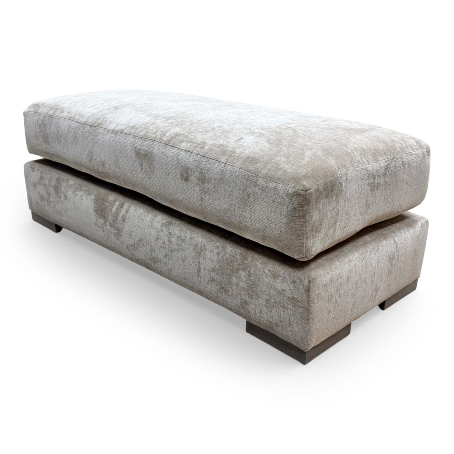 Side view of the Jackson velvet bench, showcasing the clean lines and uniform cushioning of the footstool.