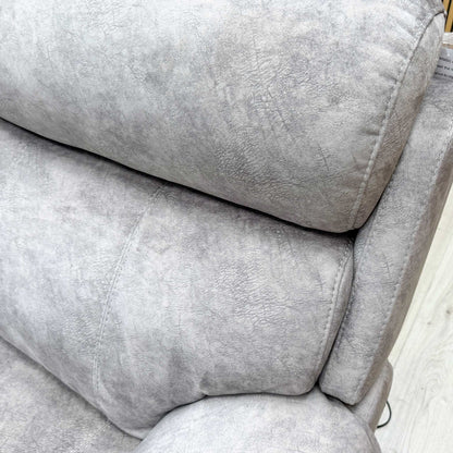 Close-up of the Ocean Blue leather texture and stitching details on the recliner sofa.