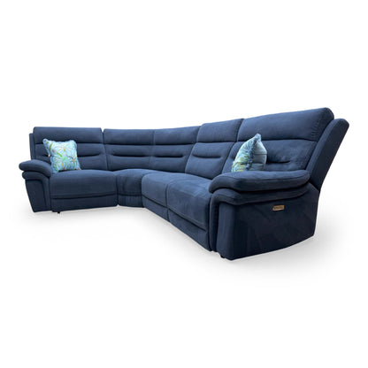 Side view of the sofa within a room setting, showing how the navy hue complements modern interiors.