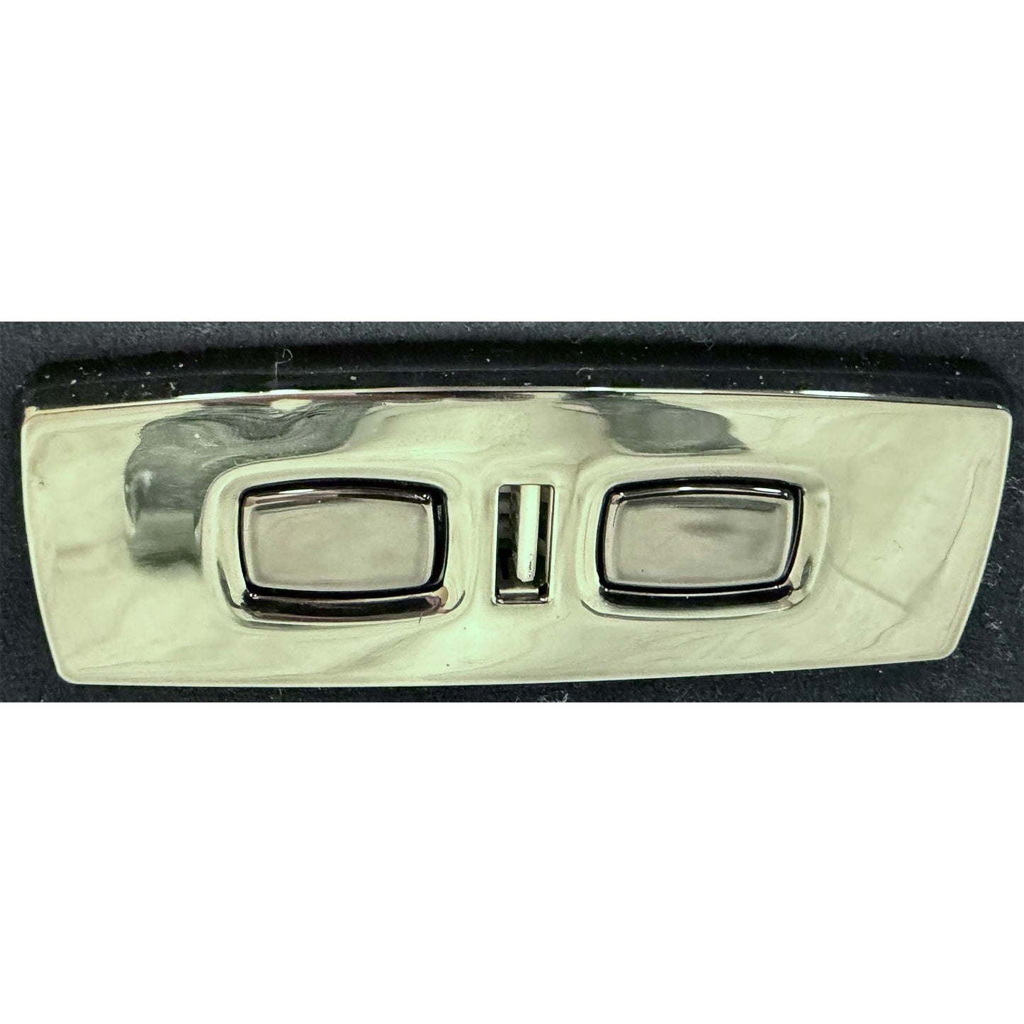 Close-up of the power control buttons located on the side of the recliner armrest.