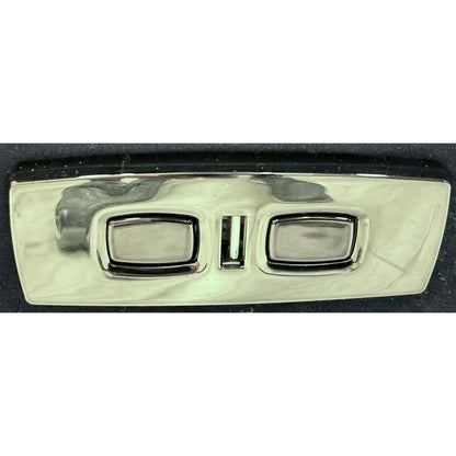 Close-up of the power control buttons located on the side of the recliner armrest.