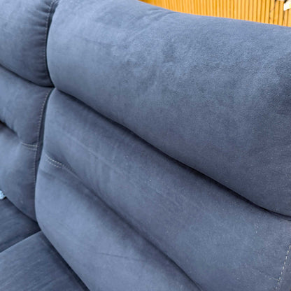 Detailed close-up of the luxurious navy blue velvet upholstery and side stitching on the Berlin sofa.