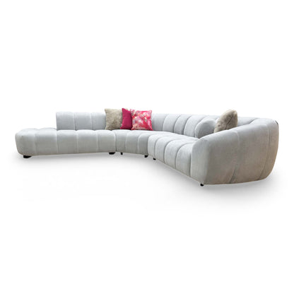 Side view of the Waldorf open-end chaise, showing the clean lines of the low backrest and the high-quality fabric wrap.