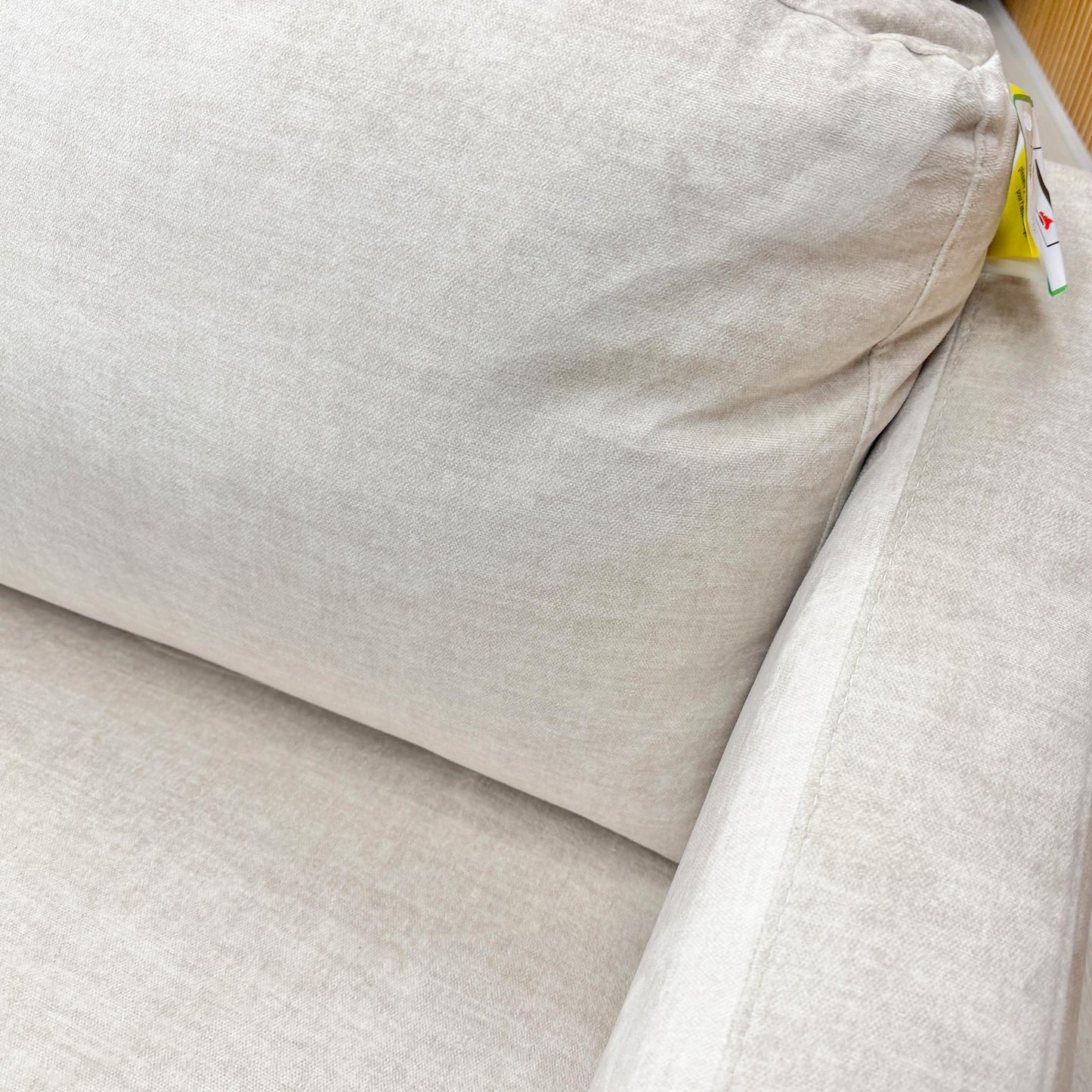 Close-up of the plush seat and back cushions of the Oslo sofa, showcasing the durability and tactile finish of the cream velvet.