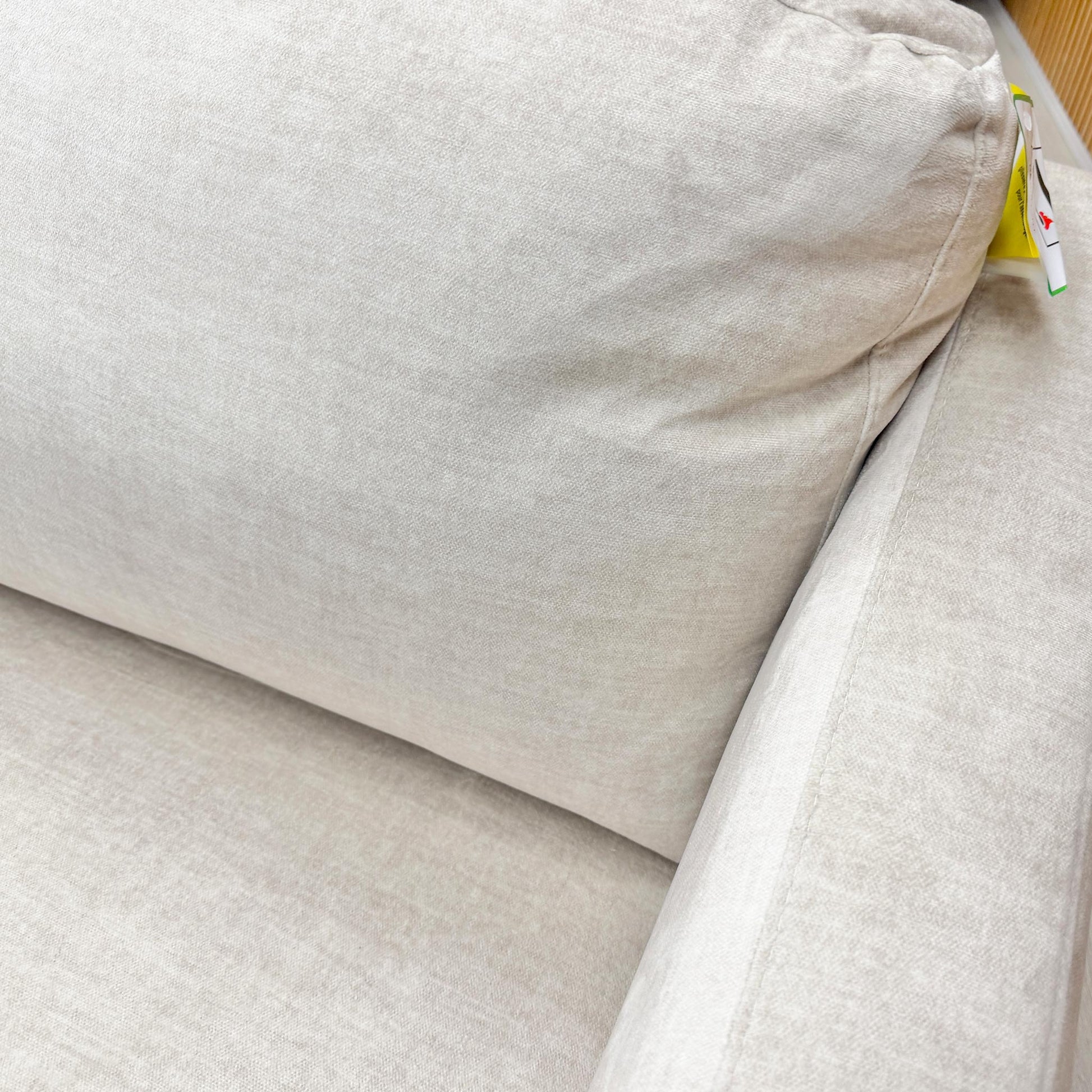 Close-up of the plush seat and back cushions of the Oslo sofa, showcasing the durability and tactile finish of the cream velvet.