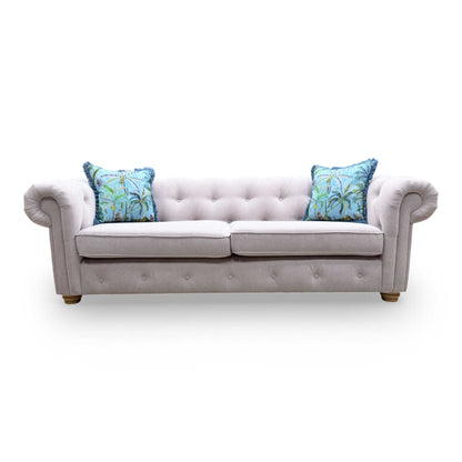 Full view of the lilac Belair sofa, demonstrating the symmetry of the rolled arms and the sophisticated aesthetic of the Plaza Linen collection.